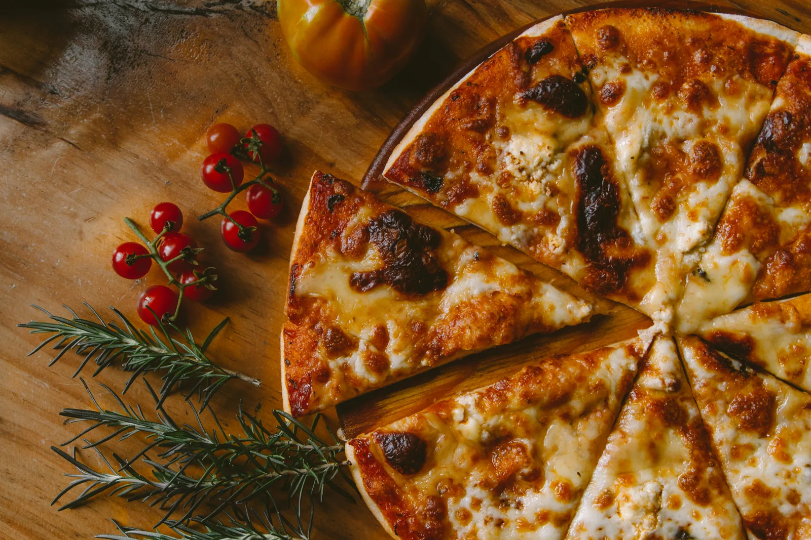 Pizzario WebP signature pizza fresh from a blazing wood-fired oven in NYC
